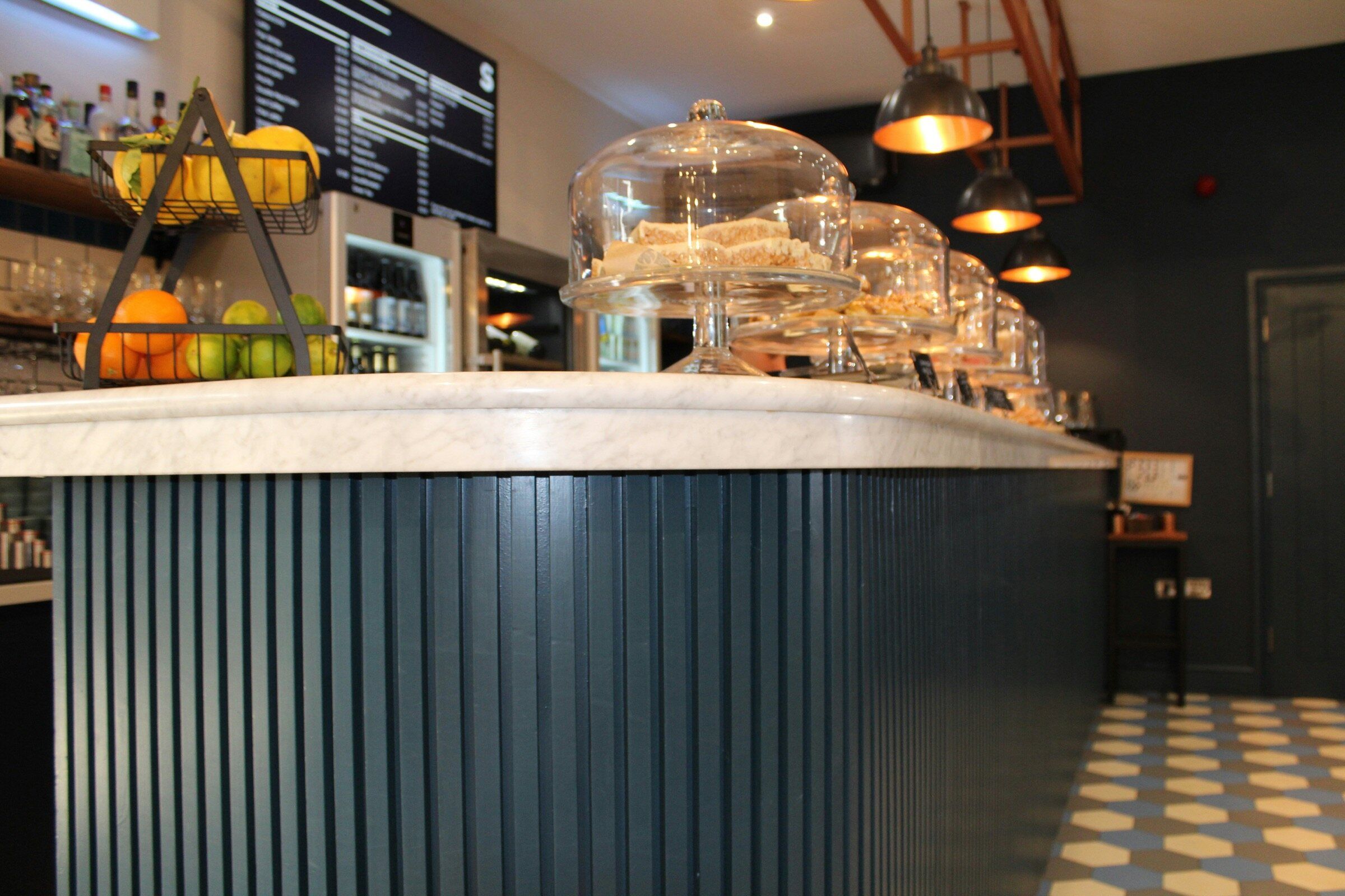 Cafe counter with glass cake domes