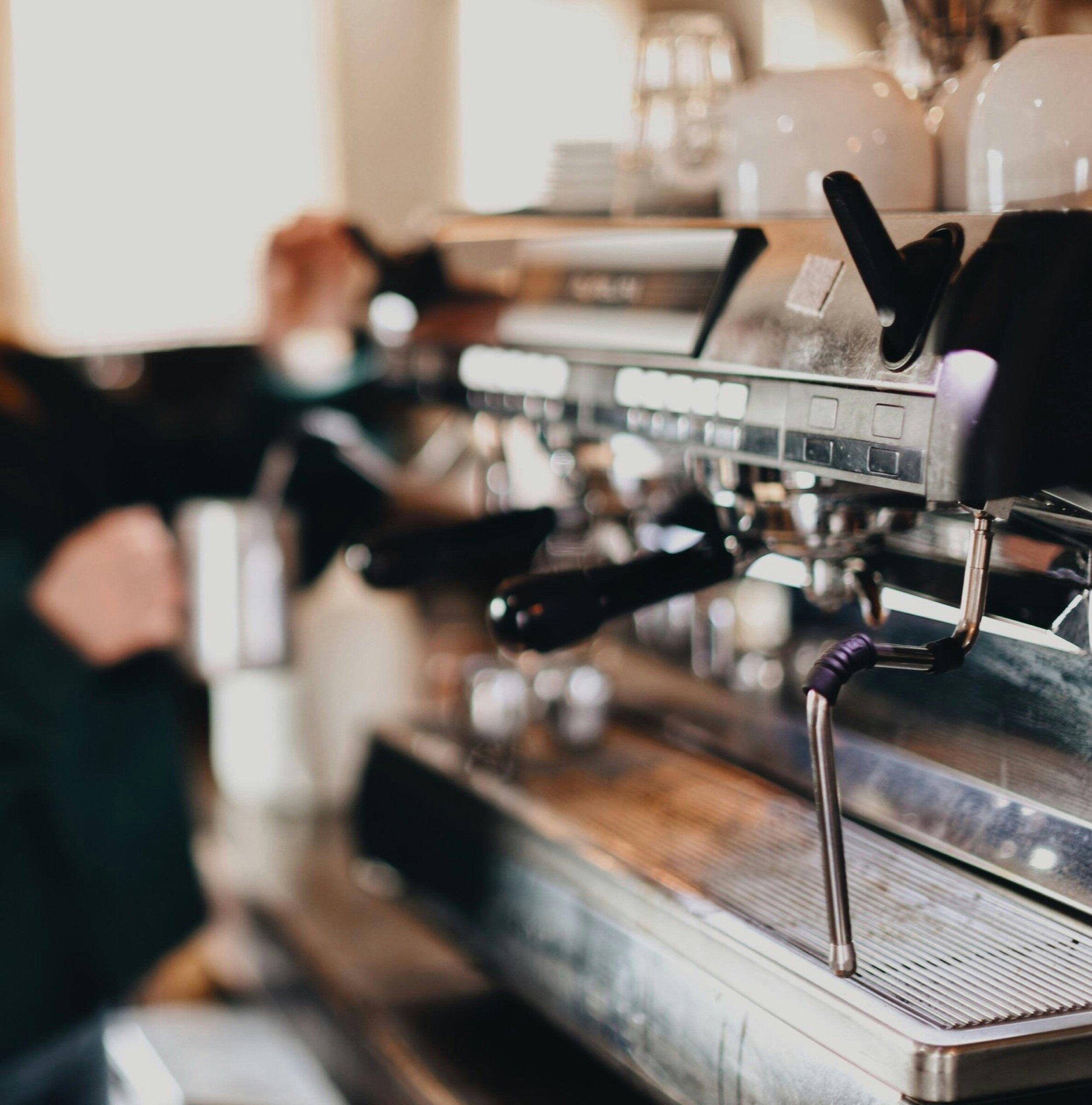 Barista at an espresso machine