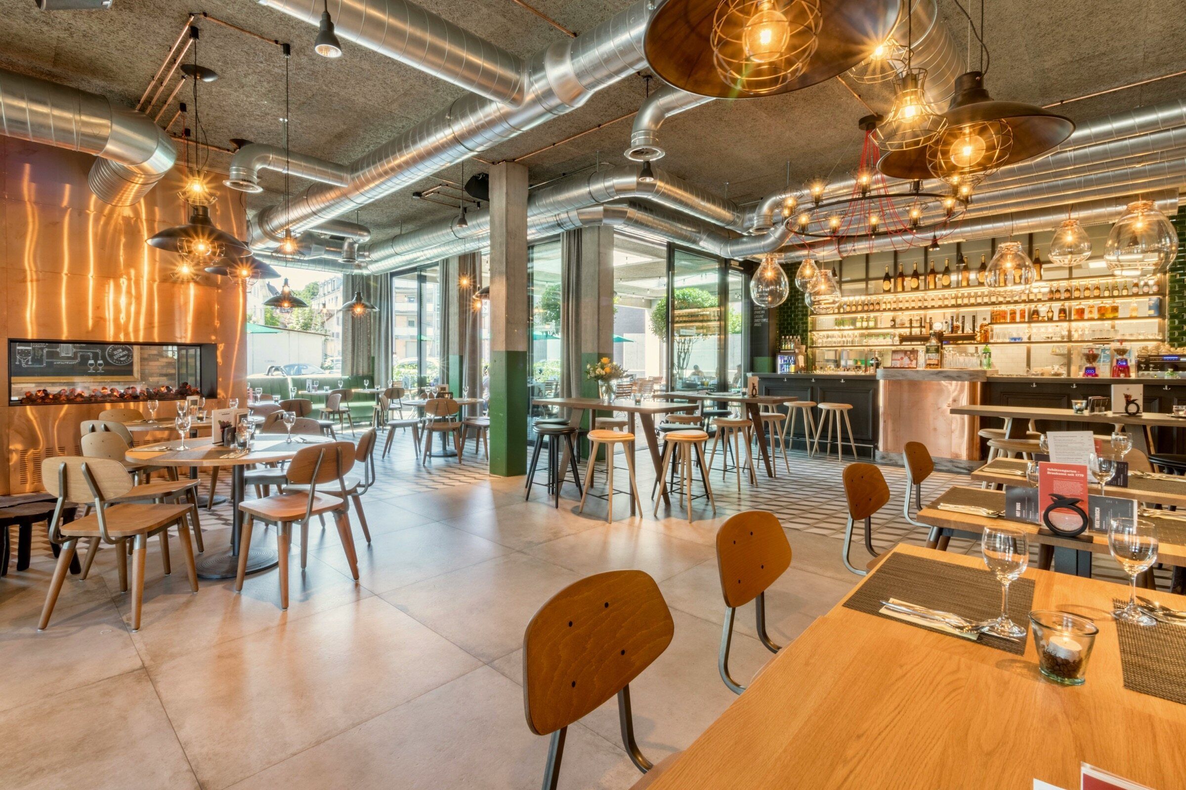 Empty restaurant dining room with wooden tables and chairs